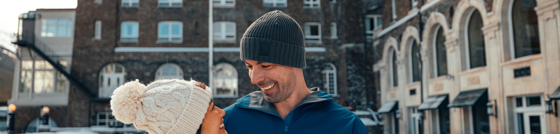 Couple stands in front of the Banff Springs Hotel