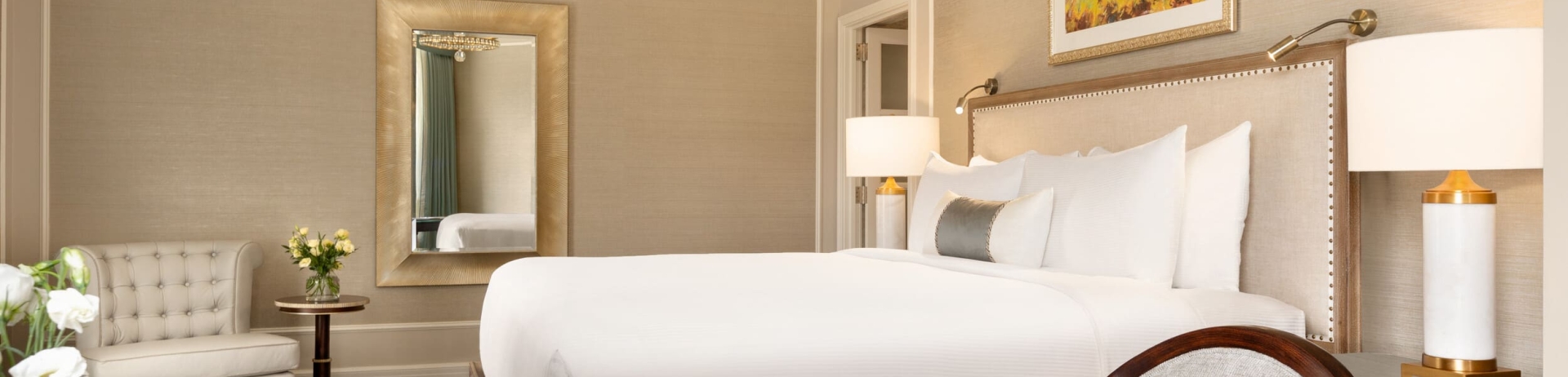 bedroom with chair and work desk with a cup of coffee