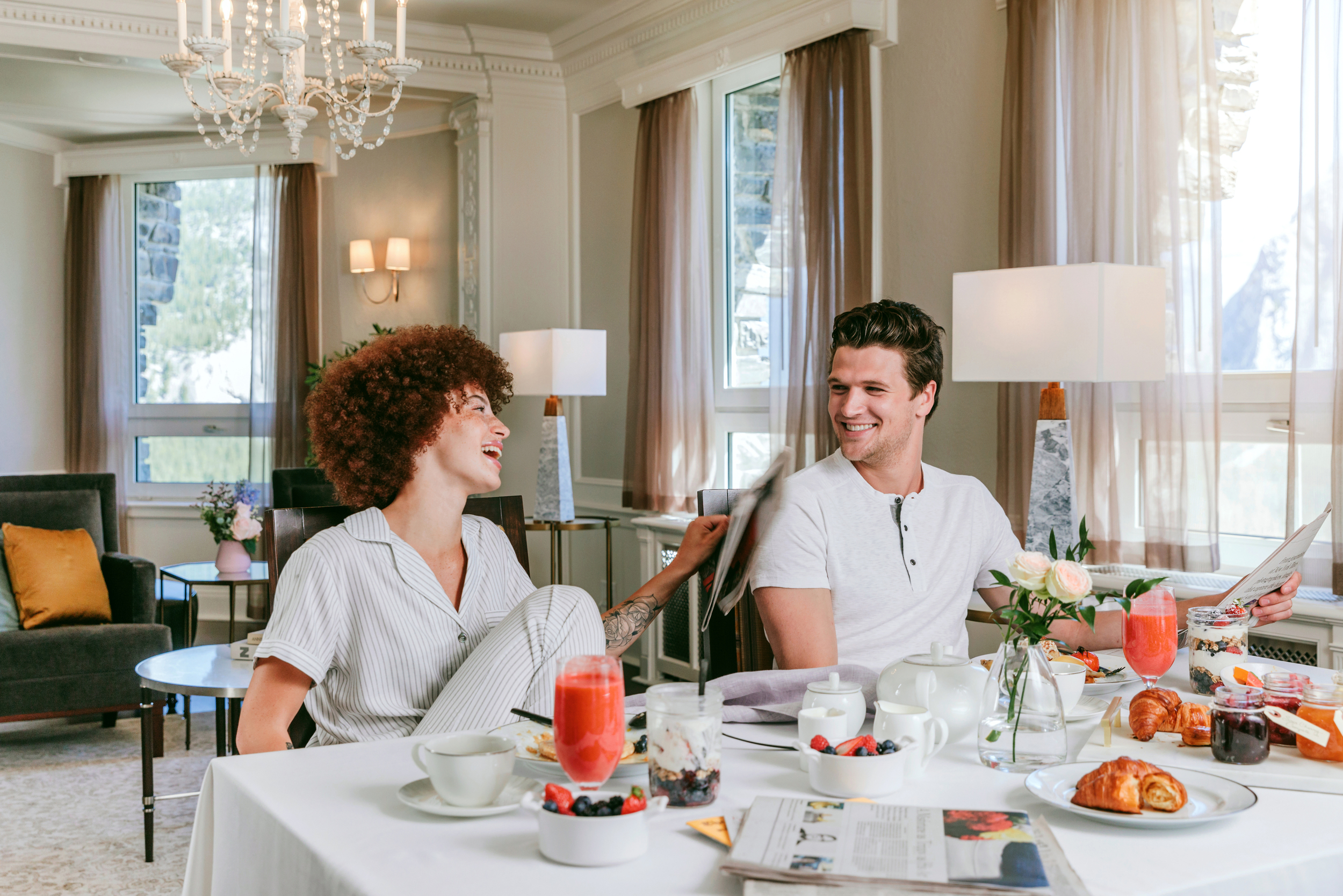 couple eating breakfast in their room