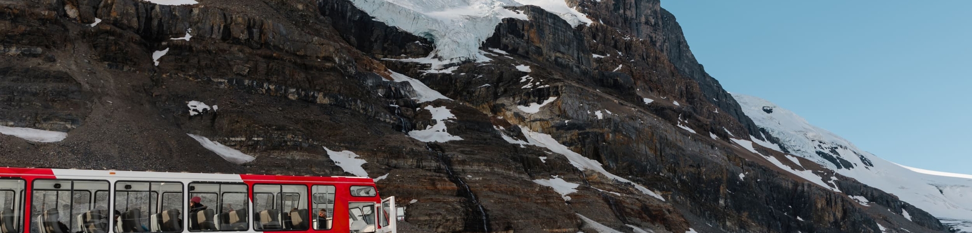 family getting on a tour bus