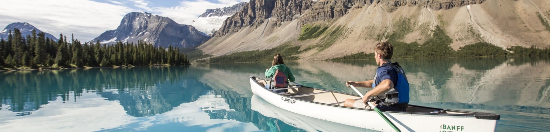 people canoeing on a lake