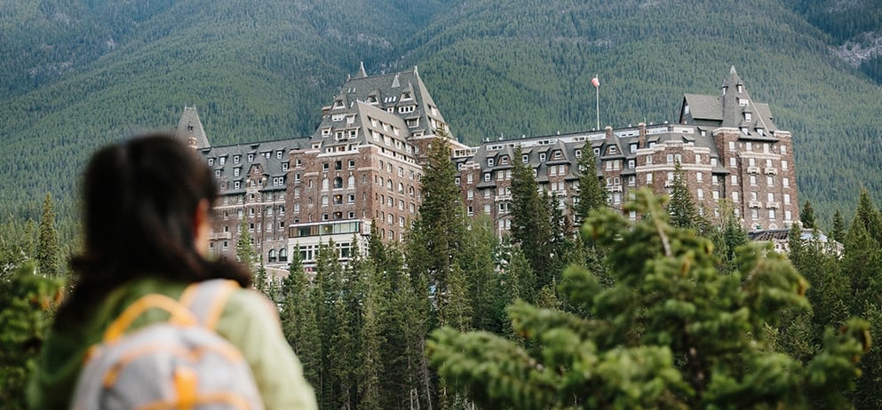 woman with a backpack looking at the resort