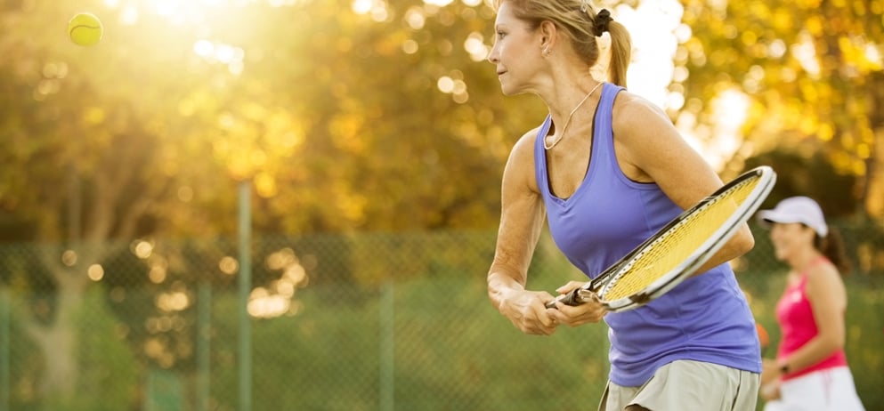 Shot of mature women playing tennis.