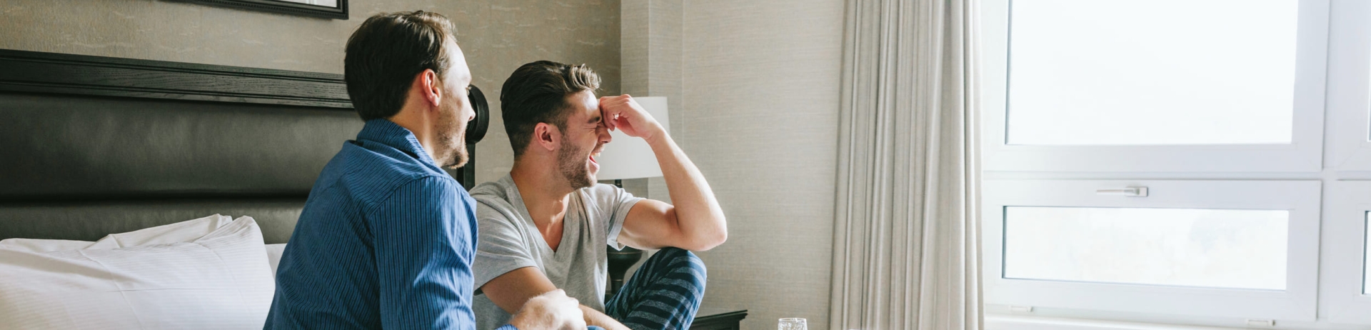 a couple eating breakfast in bed