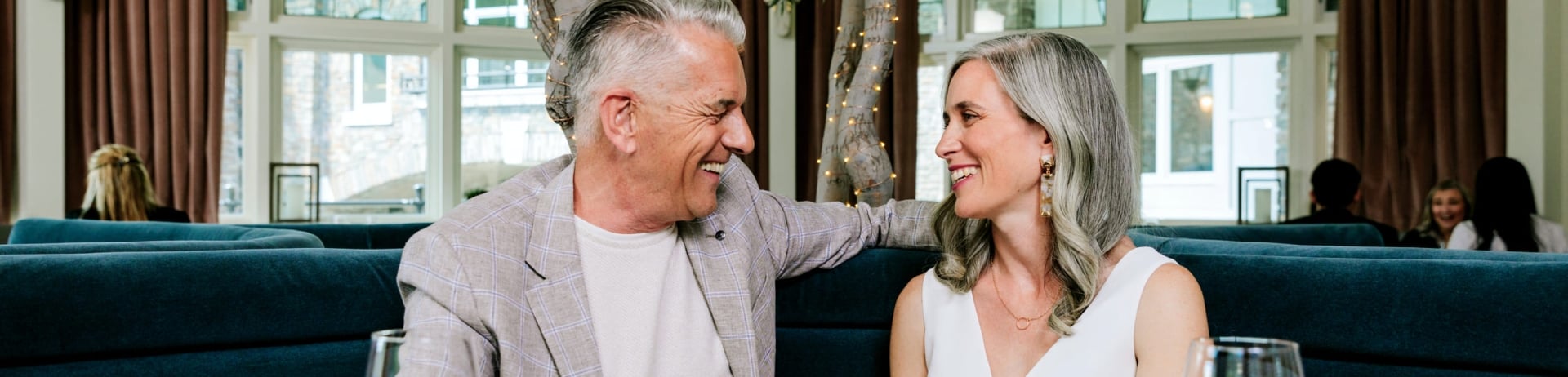 a senior couple eating dinner