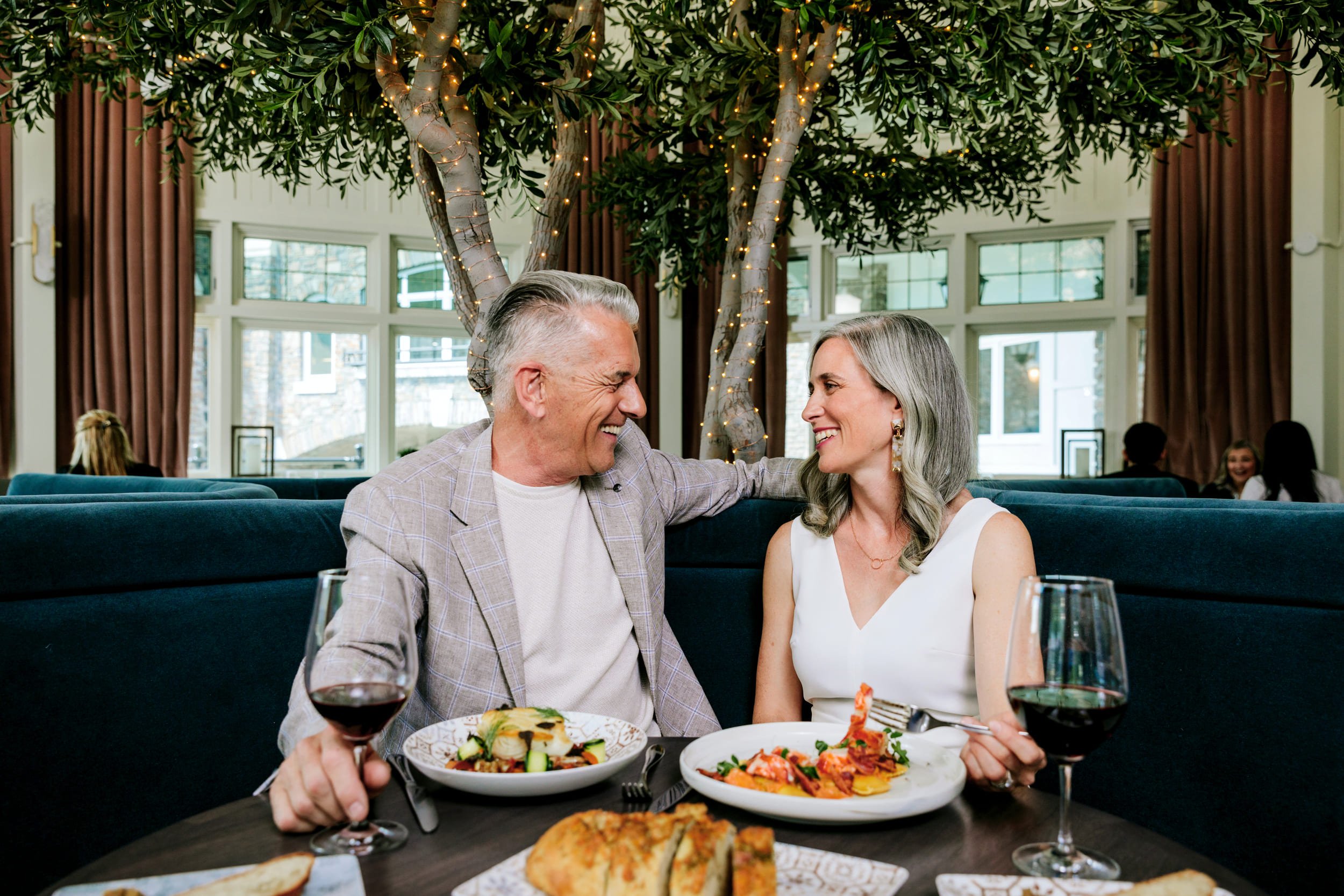 a senior couple eating dinner
