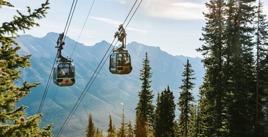 gondolas taking people to the top of the mountain