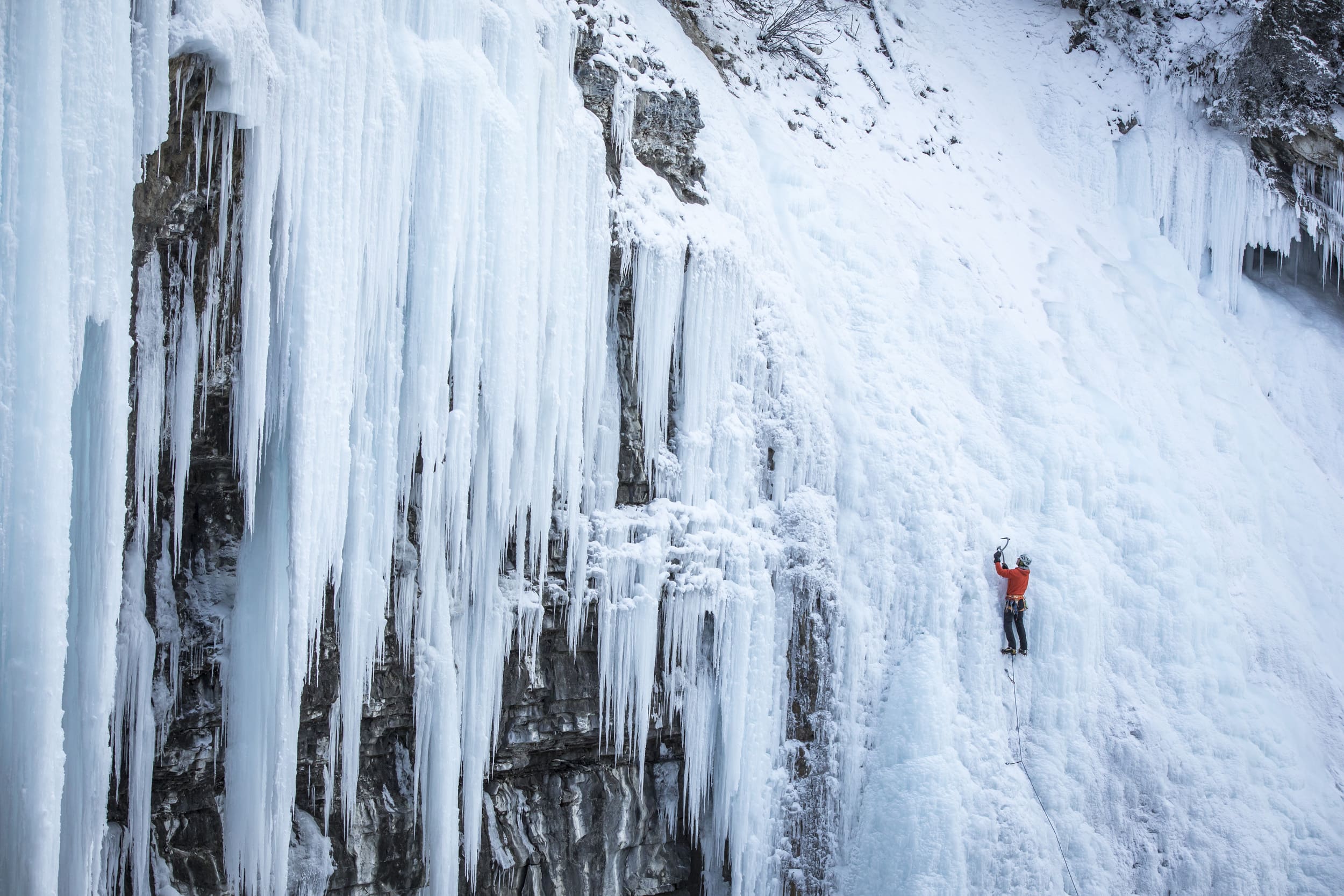 a man ice climbing