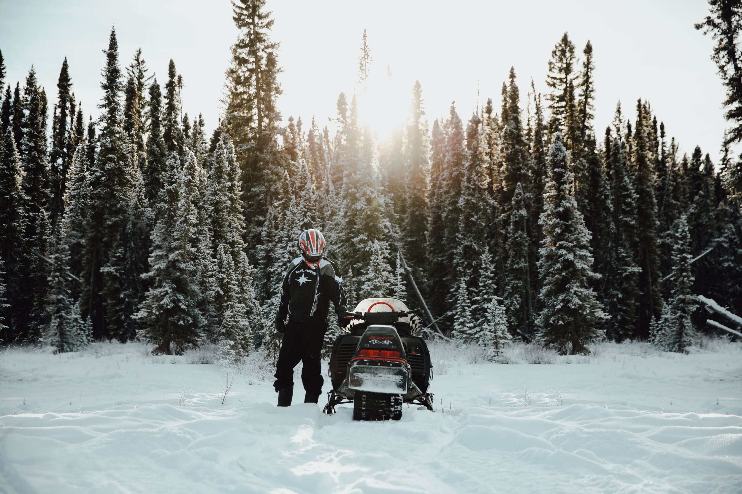 a man parking a snowmobile