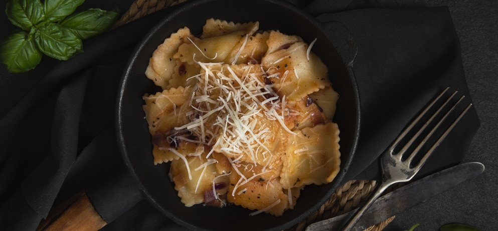 close up of a skillet of ravioli