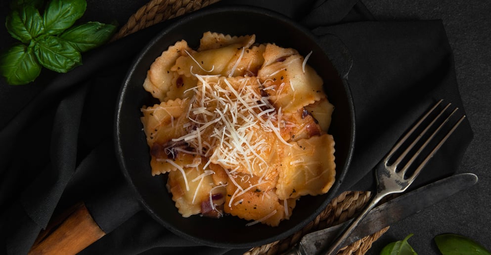 close up of a skillet of ravioli