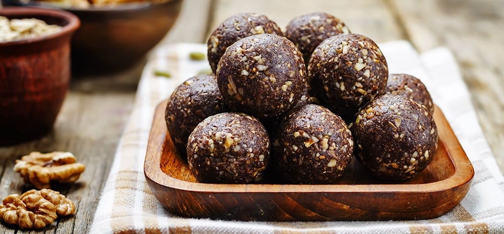 Dates cocoa coconut oats walnuts raw vegan balls