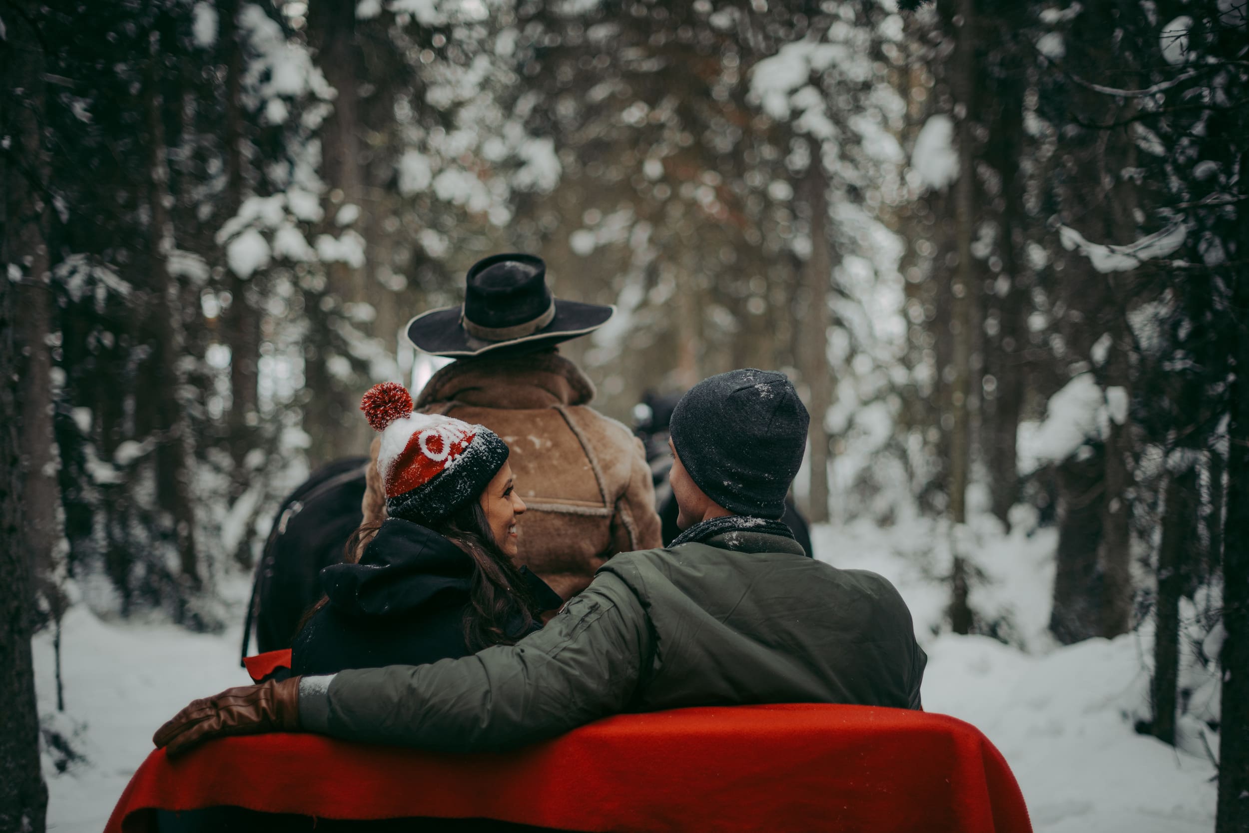 a couple on a sleigh ride