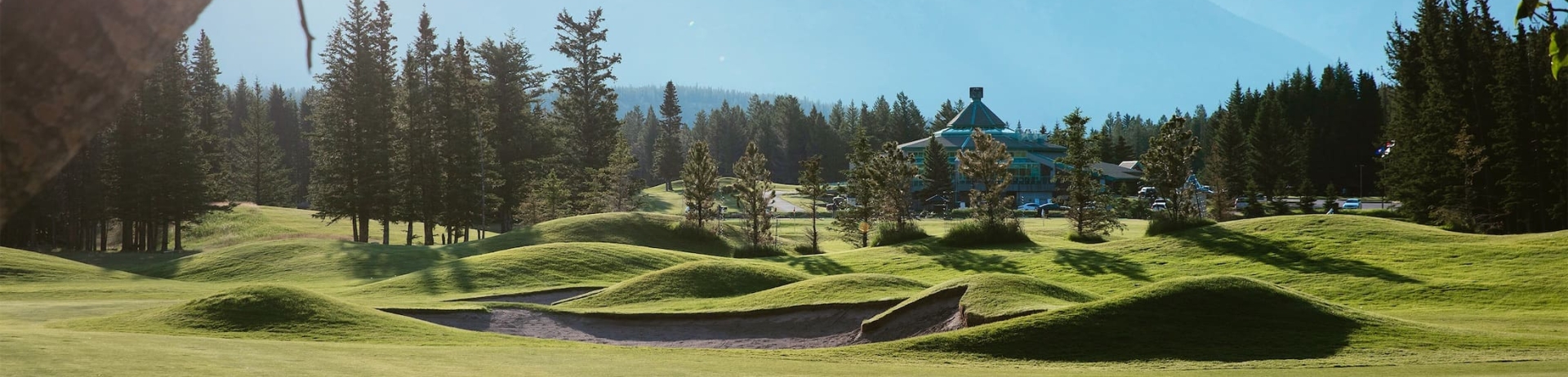 golf course with view of golf shop