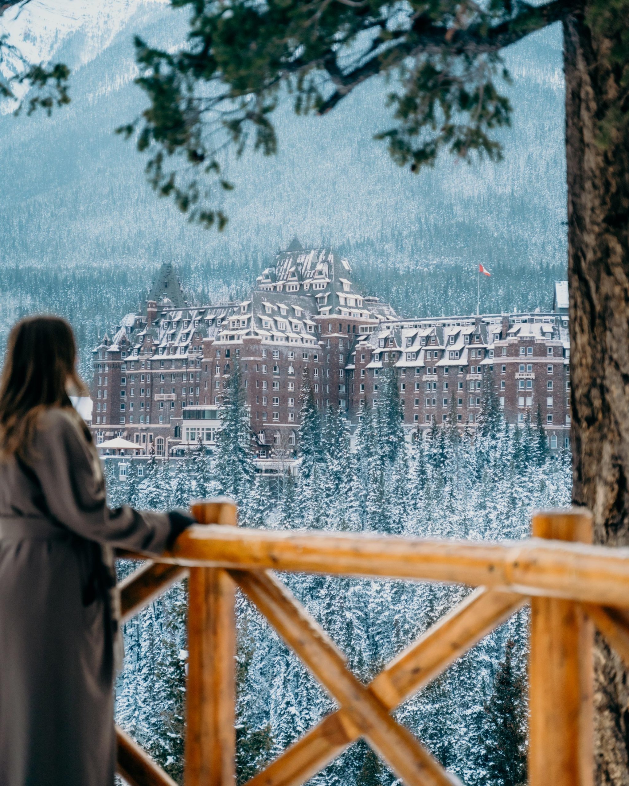woman looking at the hotel from a trail