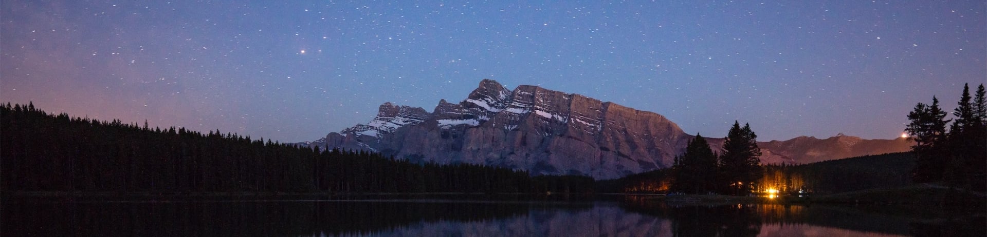 starry night over the lake and mountains