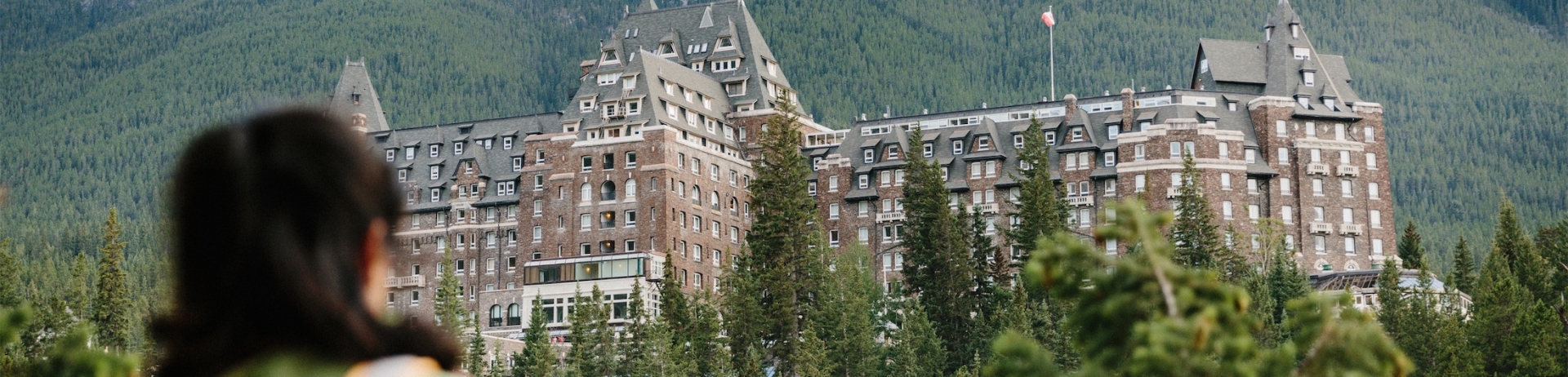 hiker admiring the hotel from a trail