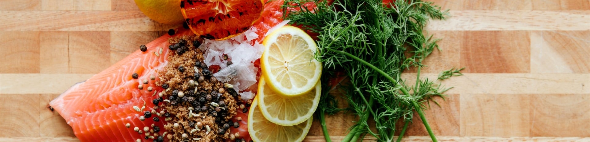 raw salmon with ingredients on top