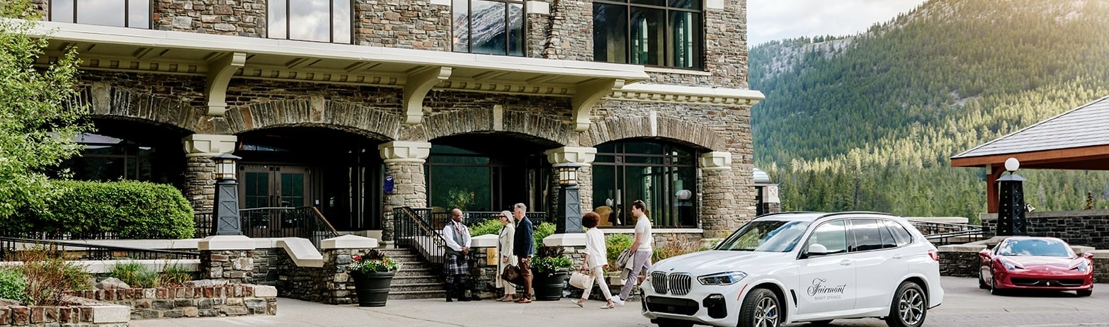 Guests arriving in the Fairmont Gold Courtyard at Fairmont Banff Springs