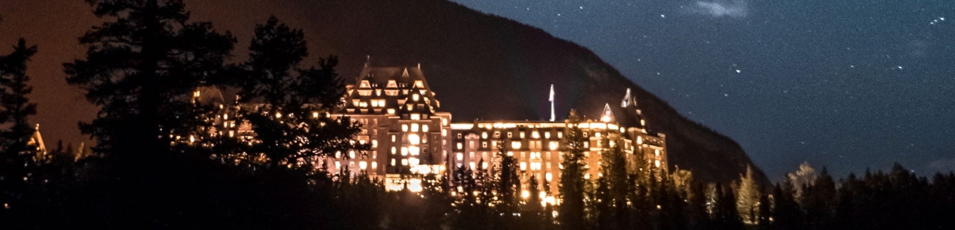 View of the Fairmont Banff Springs under the night sky in Banff National Park